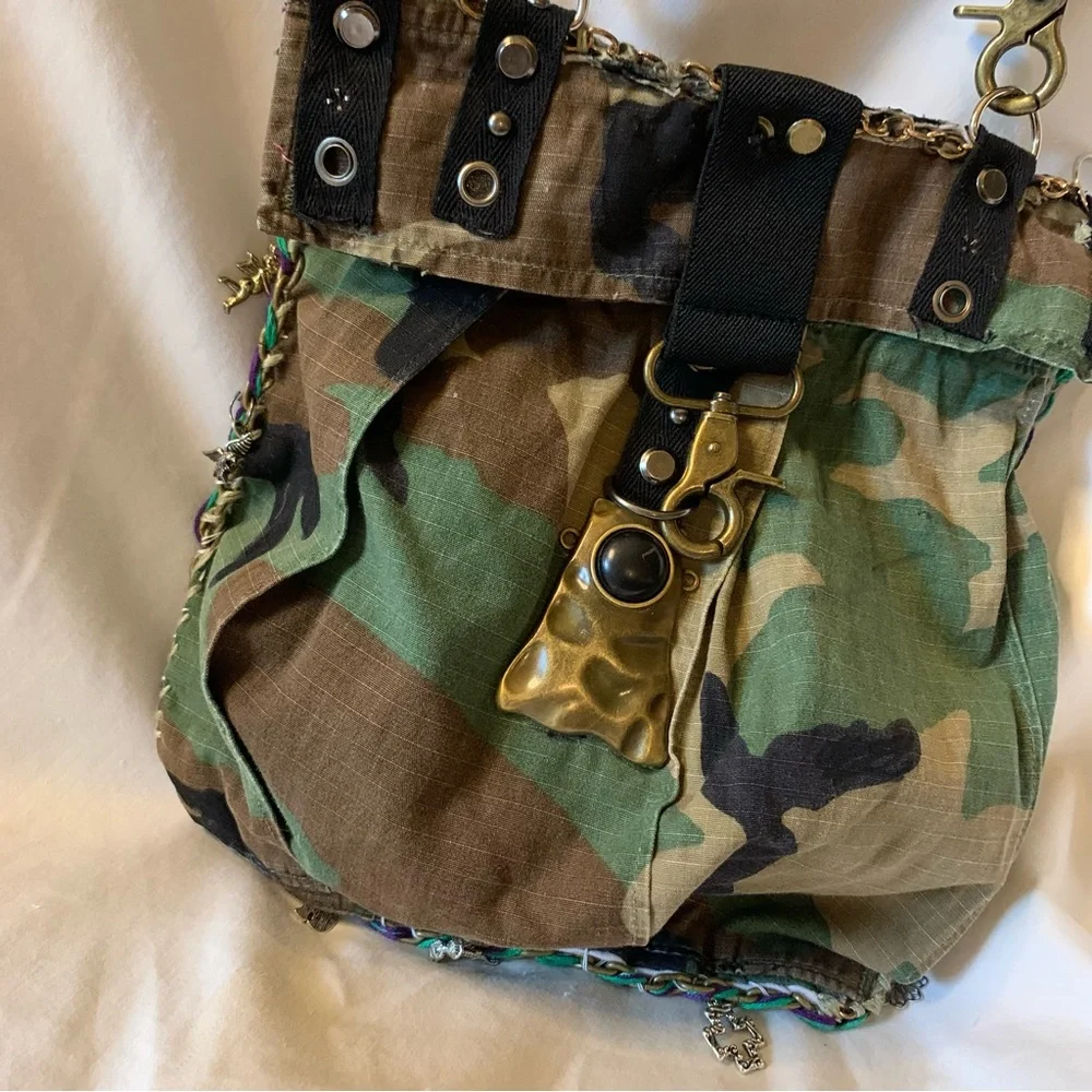 Camouflage Crossbody Bag with Gold Accents and Image of JK Punkmetal Sculpture. - Picture 4 of 7